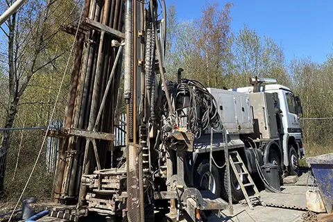 Drilling monitoring wells into abandoned mine workings